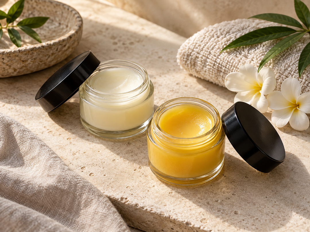 Editorial illustration: Two open small cosmetic balm jars showing white balm and golden yellow balm, black lids alongside and spa towel.