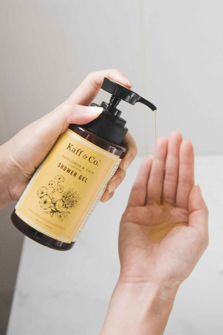 Kaff & Co Safflower and Cica Shower Gel being dispensed into a hand