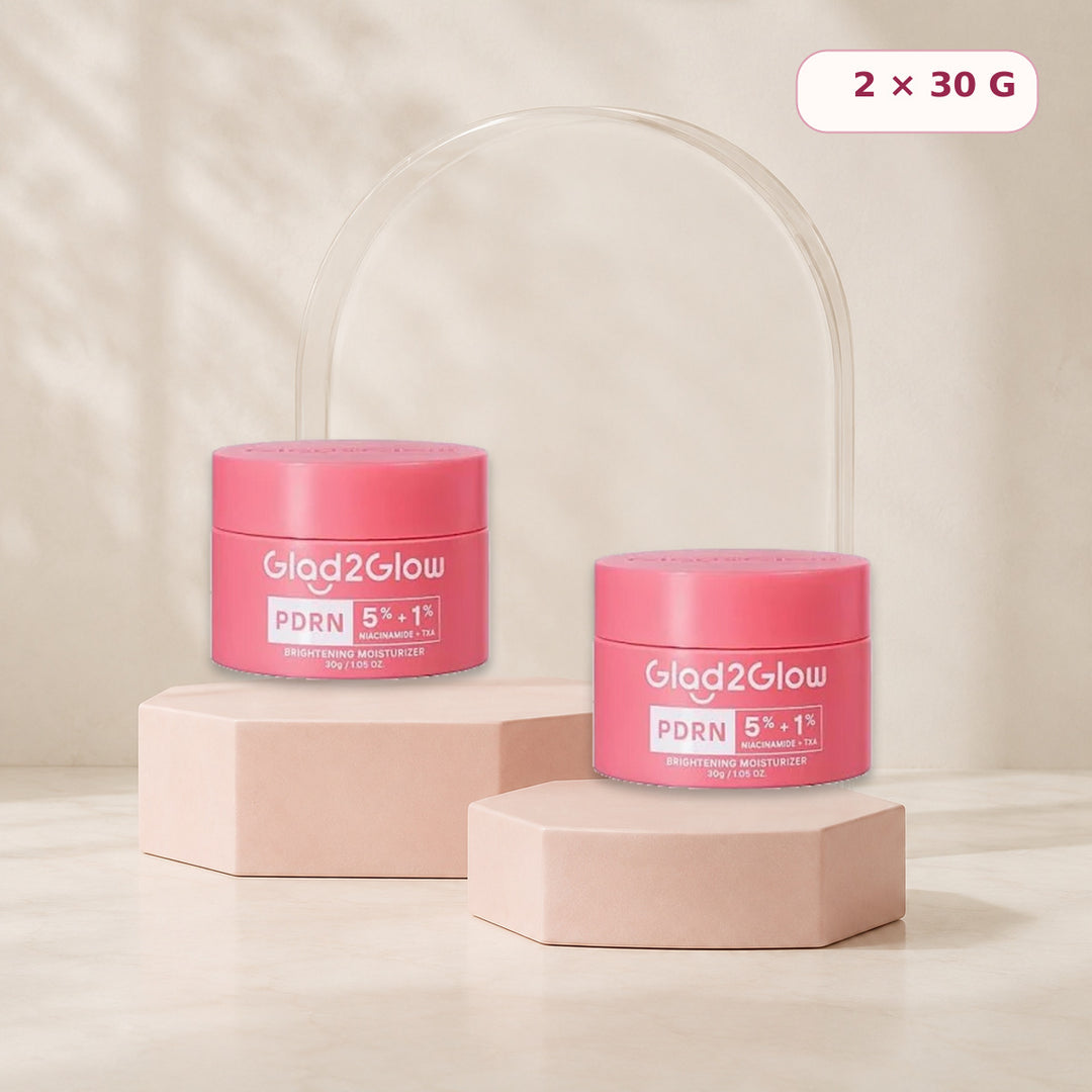 Two Glad2Glow PDRN moisturizers displayed on blush pink risers
