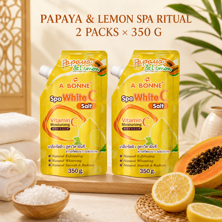 Two A BONNE Papaya and Lemon Vitamin C Spa Salt pouches in a Thai-inspired spa setting

