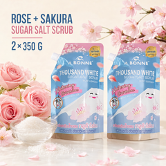 A BONNE Rose and Sakura Sugar Salt Scrub twin pack with flowers and scrub crystals