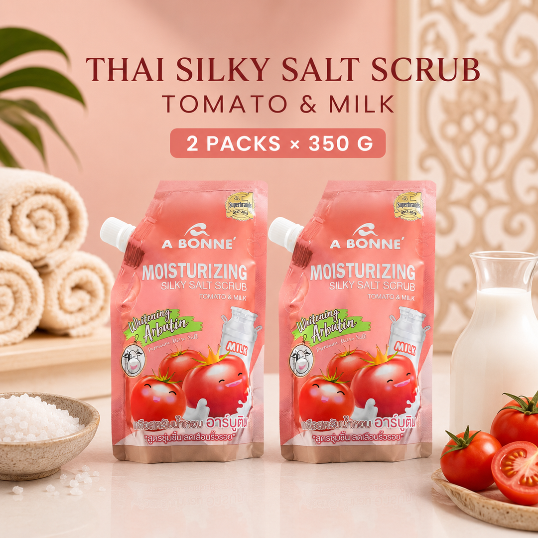 Two A BONNE Tomato and Milk Silky Salt Scrub pouches in a Thai-inspired spa setting