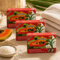 Three ASANTEE Papaya & Rice Milk Soap No.331 boxes in a warm home spa setting
