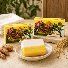 ASANTEE Turmeric and Rice Milk Soap three-bar bundle displayed with turmeric roots and rice stalks