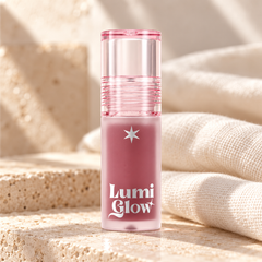 beWiLD Lumi Glow Lip Tint Oil, shade 01 Nudy Fig, on a sunlit beauty vanity