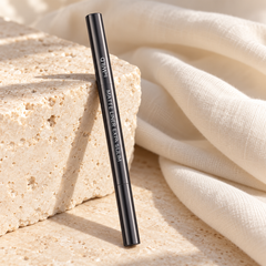 beWiLD Matte Liner Extra Slim, shade 01 Inky, on a sunlit beauty vanity