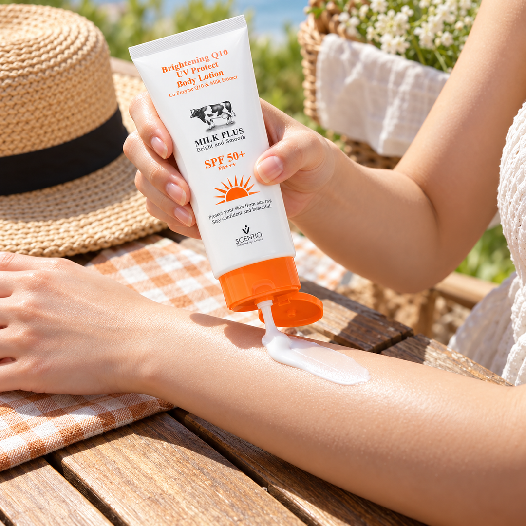 Scentio Milk Plus Q10 UV Protect Body Lotion SPF 50+ PA+++ 100 ml — body sunscreen being applied to an arm outdoors
