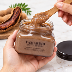 Scentio Very Thai Tamarind Body Scrub 300 ml — open scrub jar held with a wooden spatula