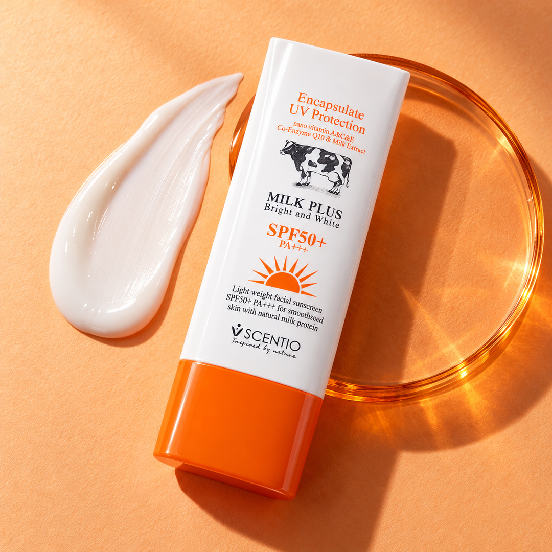 Scentio Milk Plus Encapsulate Sunscreen UV Protection SPF 50+ PA+++ 30 ml — tube beside cream texture on an orange surface