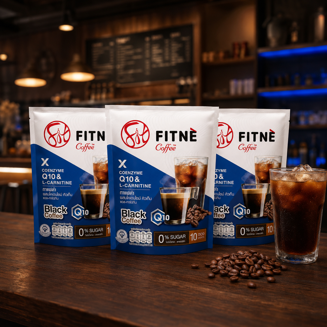 FITNÉ Black Coffee Q10 three-pack bundle with iced black coffee in a warm café setting