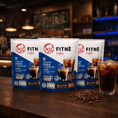 FITNÉ Black Coffee Q10 three-pack bundle with iced black coffee in a warm café setting