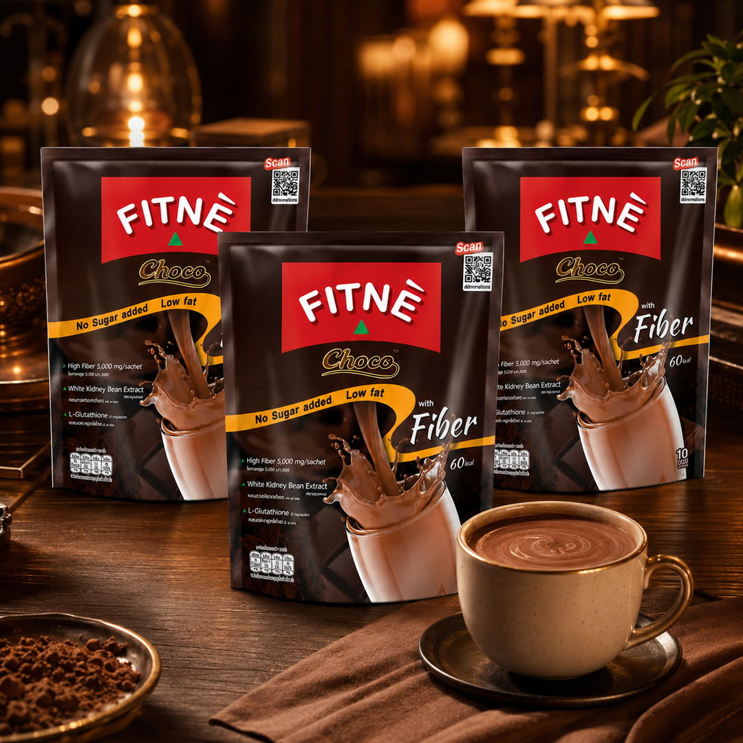 FITNÉ Choco Fiber three-pack bundle with a cup of cocoa in a warm café setting