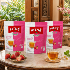 FITNÉ Strawberry Herbal Infusion 3-pack bundle in a warm Thai-inspired tea room