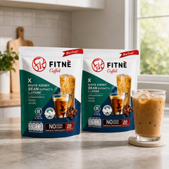 Two FITNÉ White Kidney Bean Coffee 20-sachet packs with iced coffee in a bright kitchen