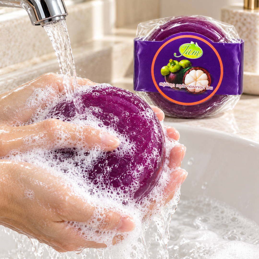 JAM Mangosteen Gluta Collagen round soap lathered under running water