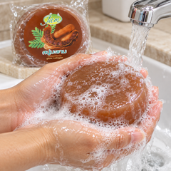 JAM Tamarind Gluta Collagen round soap lathered under running water