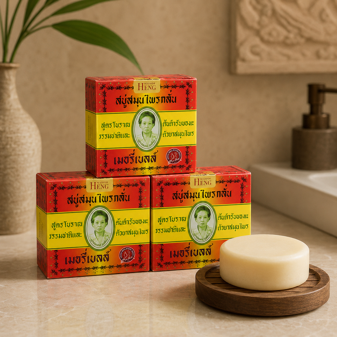 Three boxes of Madame Heng Merry Bell Original Herbal Soap with round soap in a warm bathroom setting