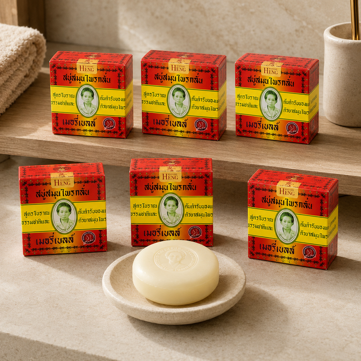 Six boxes of Madame Heng Merry Bell Original Herbal Soap with round soap in a premium bathroom setting