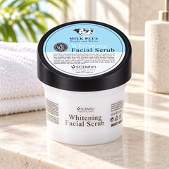 Scentio Milk Plus Whitening Q10 Facial Scrub 100 ml — jar beside a towel on a stone bathroom counter
