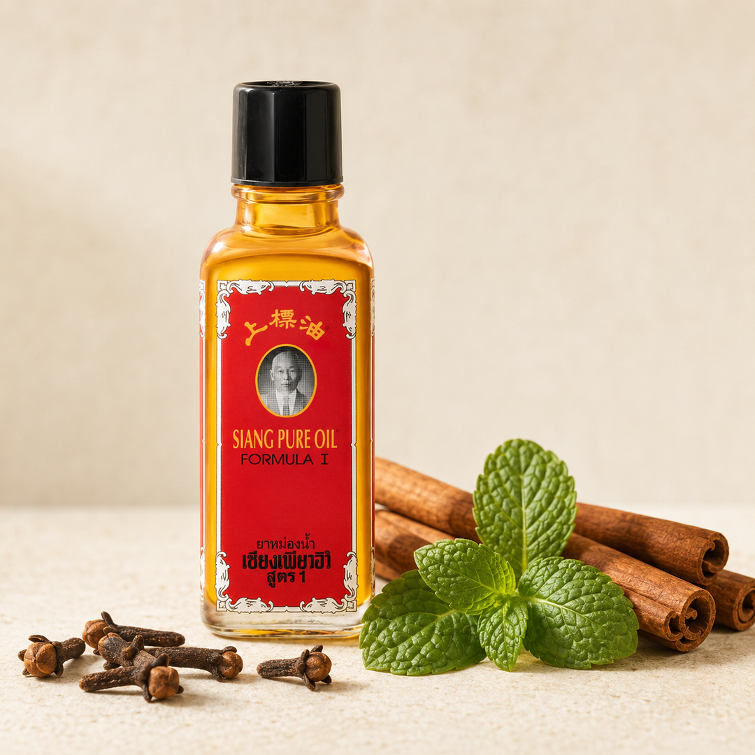 Siang Pure Oil Formula 1 bottle with cinnamon, cloves and peppermint leaves