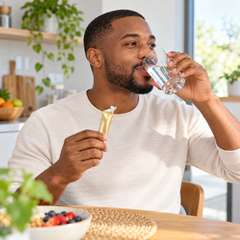 Man drinking water after taking CHAMÉ Sye S Plus oral powder