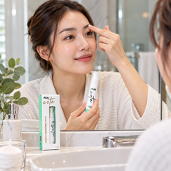 Applying AloEx Cute Eyebrow Nourishing Cream to brows