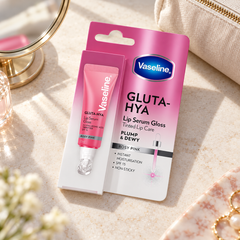 Vaseline Gluta-Hya Lip Serum Gloss Rosy Pink on a dressing table