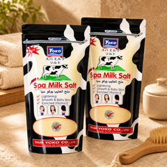 Two packs of YOKO Spa Milk Salt displayed in a warm home spa setting